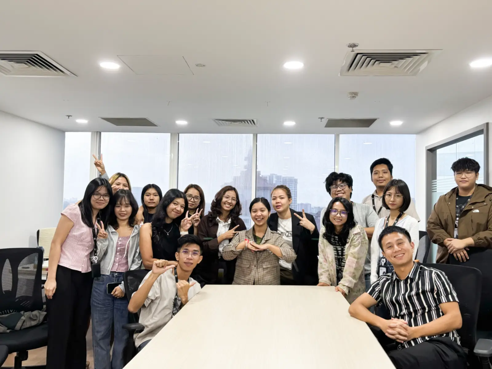 O' Ze colleagues sharing an informal Friday Drink gathering in the office